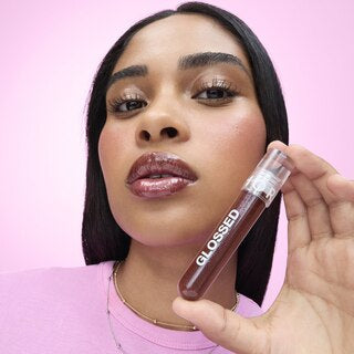 Glossed lip gloss, Sephora Collection, 5ml, dark berry shade, held by model